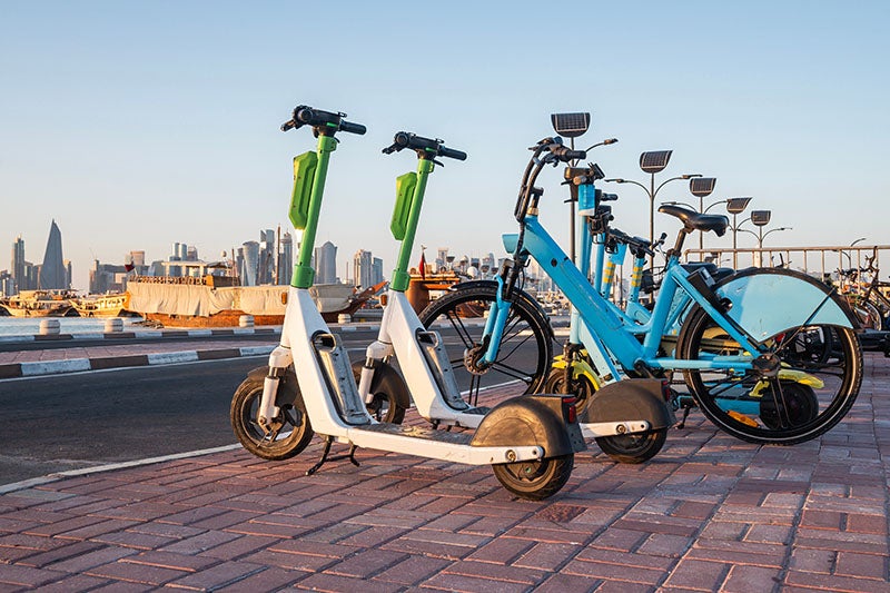A group of bicycles parked on a brick surface